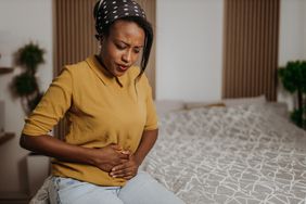 person with acute pancreatitis experiencing abdominal pain
