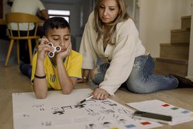 young boy with adhd fidgeting while learning