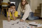 young boy with adhd fidgeting while learning