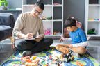 young boy with adhd receiving treatment from therapist 