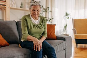 person with amyloidosis experiencing joint pain