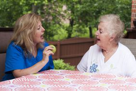 older adult getting speech therapy for aphasia 