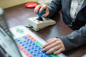 person using assistive device keyboard
