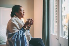 woman with autoimmune disorder sitting in bed