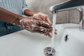 person washing hands to prevent getting a bacterial infection