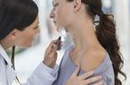 person getting checked for basal cell carcinoma at dermatologist