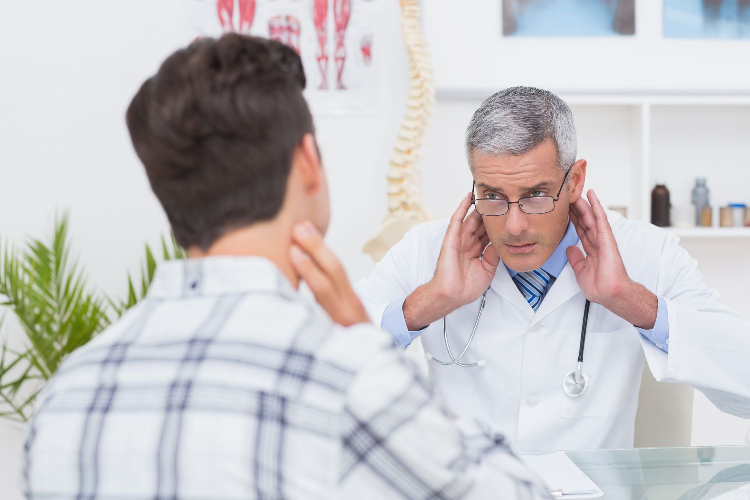 doctor checking person with possible bell's palsy