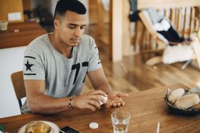 man taking chlamydia medication