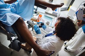 person getting a colposcopy biopsy in a gynecologist's office