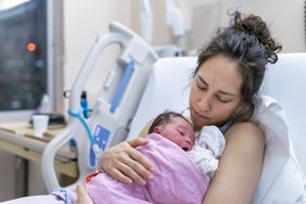 mother holding baby with congenital heart disease