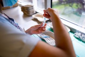 Nurse preparing for a COVID vaccination at a hospital
