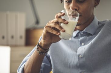 person drinking milk