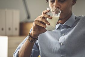 person drinking milk