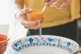 Hands seperating an egg