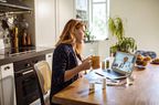 Woman having video consult with doctor about constipation