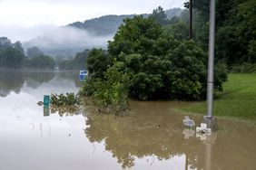JACKSON, KY - JULY 29: Flooding from the North Fork of the Kentucky River came over Bert T Combs Mountain Parkway outside of Jackson, Kentucky on July 29, 2022 in Breathitt County, Kentucky. At least 16 people have been killed and hundreds had to be rescued amid flooding from heavy rainfall. (Photo by Michael Swensen/Getty Images)