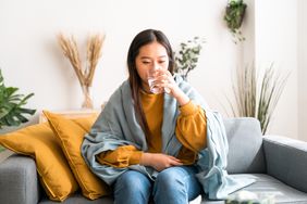 person with food poisoning drinking water as treatment to improve symptoms