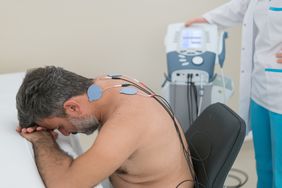 Man with electrodes on neck for vagus nerve stimulation