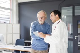 Older man talking to a doctor