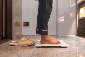 Person using a bathroom scale
