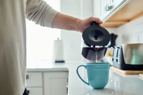 Man pouring a cup of coffee