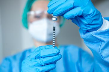 Doctor filling a shot