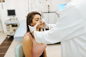 doctor examining a woman patient 