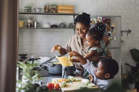 Mom cooking with her children