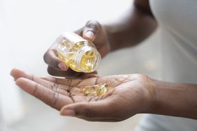 Woman taking a supplement