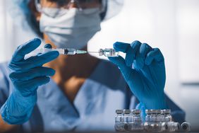 Doctor preparing a COVID-19 vaccine