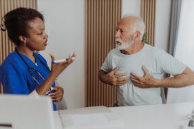 older man discussing lung cancer with this doctor