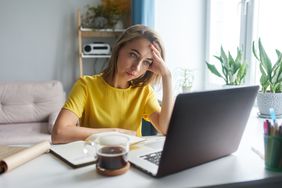 exhausted woman working at computer