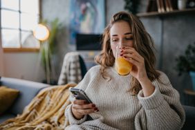 Woman drinking orange juice