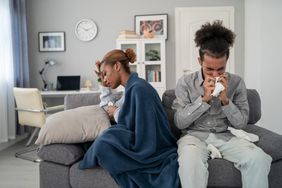 two people sick on couch together