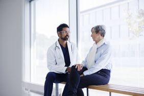 Woman talking to doctor