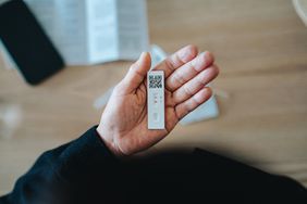 Woman holding a COVID rapid test