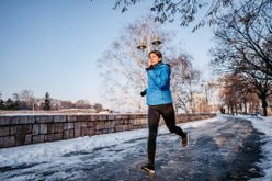 Young woman jogging in winter