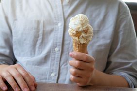 Person holding ice cream cone
