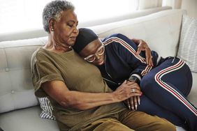 woman comforting daughter with stage 4 cancer