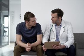 Man talking to doctor