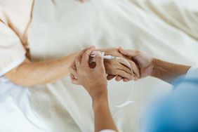 Older patient receiving an infusion