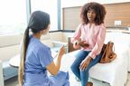 person talking about stomach ache with doctor