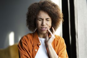 a woman with a toothache