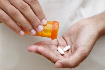 Person taking a pill