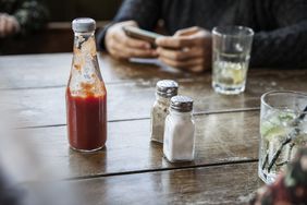 Salt and pepper on table