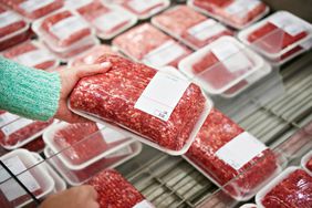 Woman buying ground beef