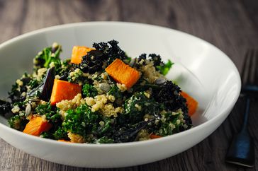 healthy foods for a rheumatoid arthritis diet such as a quinoa kale salad with roasted sweet potatoes and pumpkin seeds