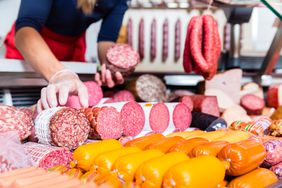Woman at butcher counter