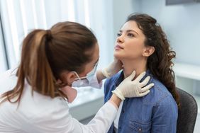 person getting a physical exam for goiter 