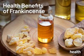 Health benefits of frankincense, A bottle of frankincense essential oil with frankincense resin on a wooden table